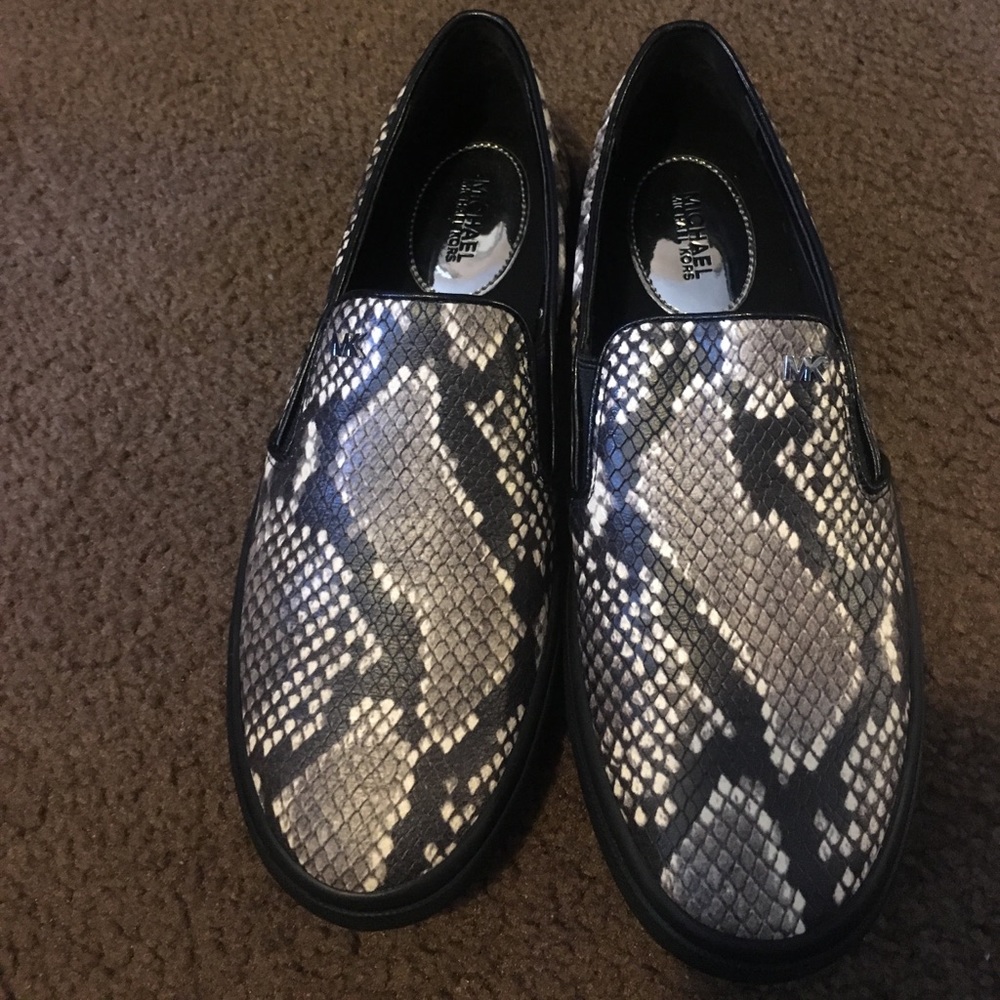 Michael Kors snake skin slip on shoes.